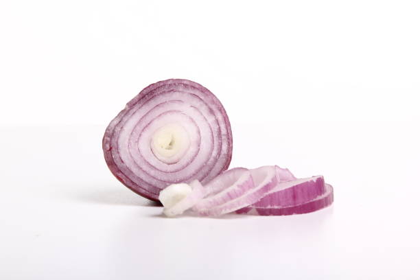 istock onion in front of a white background 1076657336