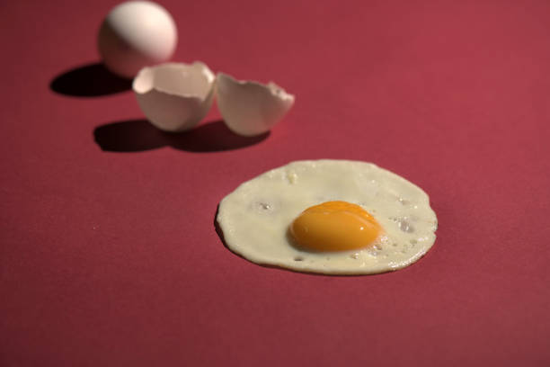 istock Scrambled eggs from a hen's egg in a frying pan. close up shot of a fried egg 1076658946