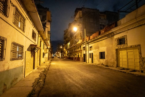istock View down an empty street in old town Havana at Night 1076660324