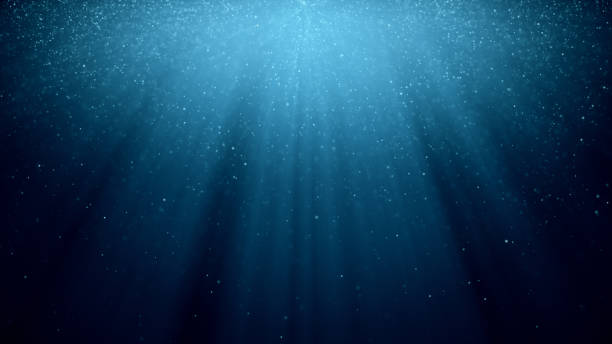 istock Abstract background with motion of shining blinking particles on blue background with rays of light. 3d illustration 1076664632