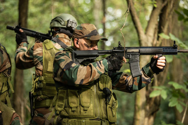 istock Military Forces Exercising in Woodland 1076665036