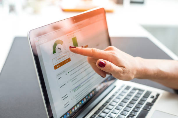 istock Cropped Hand Pointing At Laptop 1076665076