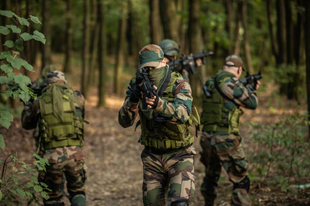istock Military Forces Exercising in Woodland 1076665080