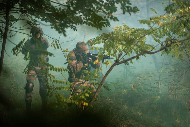 istock Soldiers in Foggy Forest 1076665604