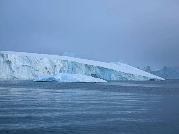 istock Arctic Icebergs on Arctic Ocean 1076666620