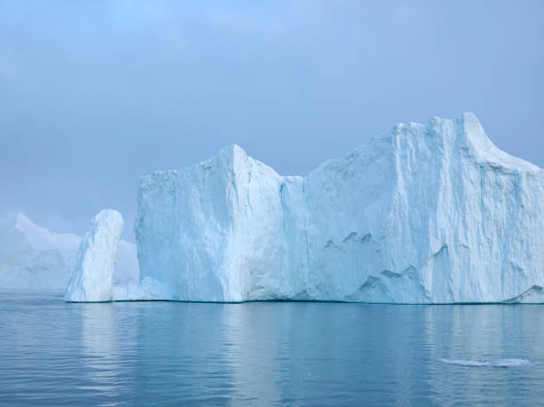 istock Arctic Icebergs on Arctic Ocean 1076668468