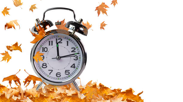 autumn season time clock and leaves isolated for background autumn season time clock and leaves isolated for background thanksgiving holiday hours stock pictures, royalty-free photos & images
