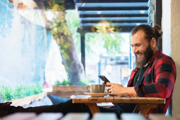 istock Bearded young man in the coffee shop 1076676584