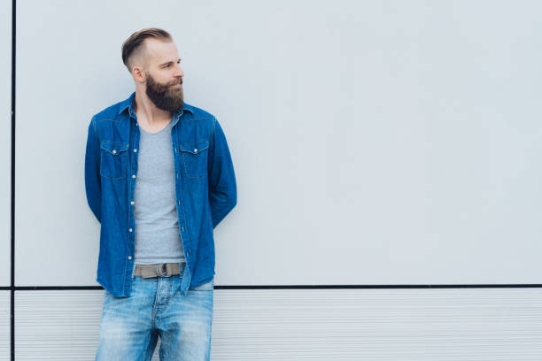 istock Casual bearded man watching to the side 1076678110