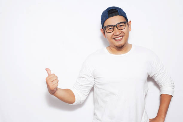 istock Young Man Showing and Pointing Something on His Side 1076679474
