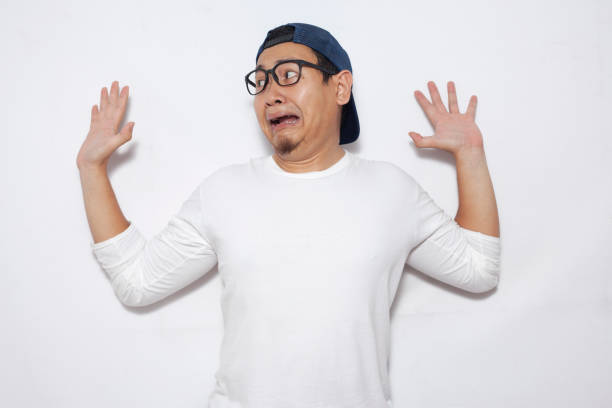 istock Young Man  Afraid With Arms Crossed, Surrender 1076681474