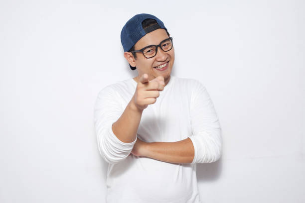 istock Young Asian Man Smiling Happily 1076682046