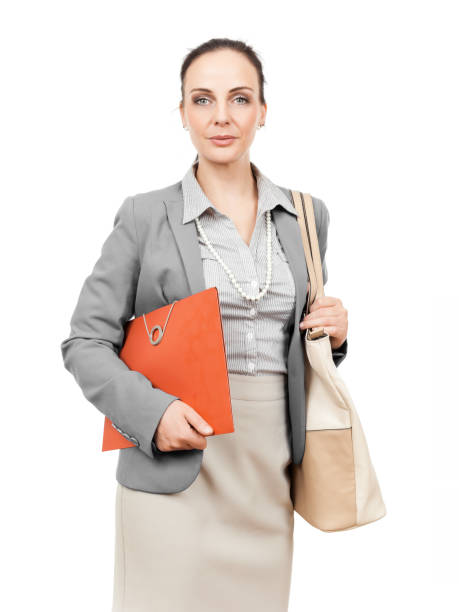 istock business woman with handbag and folder 1076685540