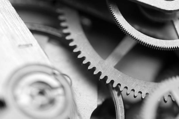 istock Black and white Background with metal cogwheels clockwork. Concept Teamwork. Macro. 1076685860