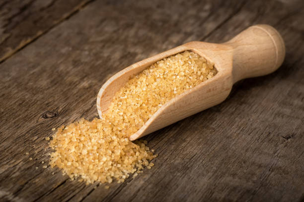 istock brown cane sugar in scoop 1076685900
