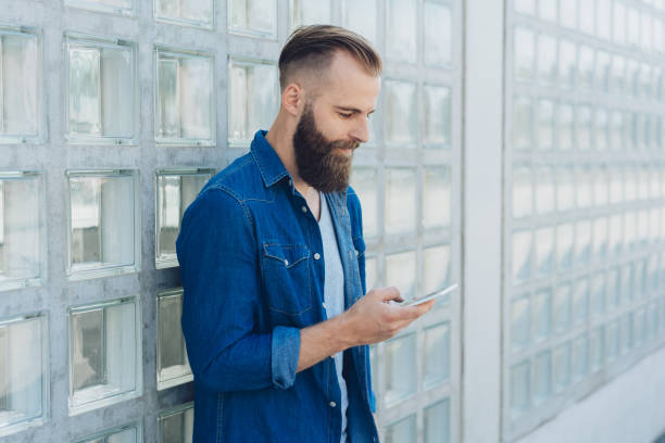 istock Modern hip young man with beard and short hair 1076689552