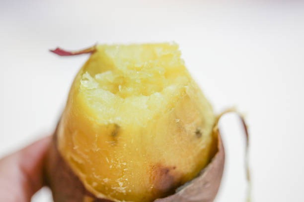 istock freshly baked sweet poatoes.Top view 1076690398