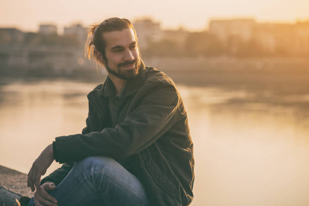 istock Modern businessman resting by the river 1076695152