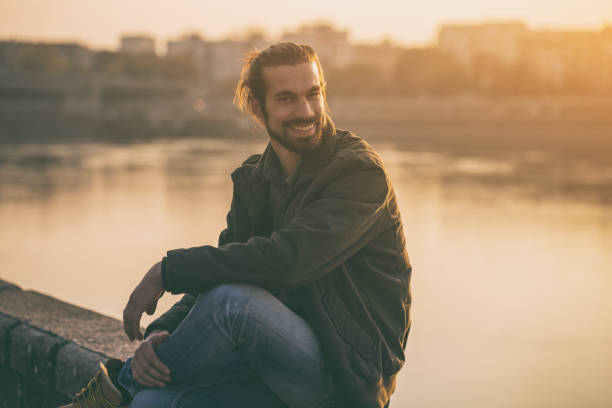 istock Modern businessman resting by the river 1076695448