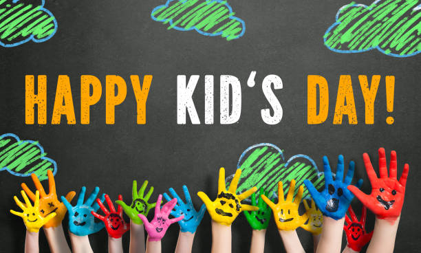 many painted kids hands with smileys and the message "Happy Childrens Day" (in German) many painted kids hands with smileys and the message "Happy Childrens Day" (in German) on a blackboard childrens day photos stock pictures, royalty-free photos & images