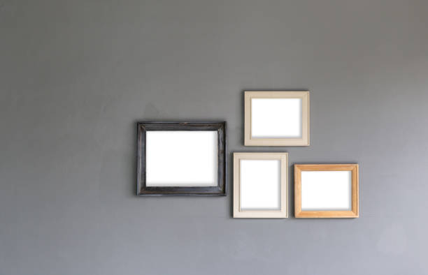 istock Group of Blank photo frames on the wall for your design 1076705278