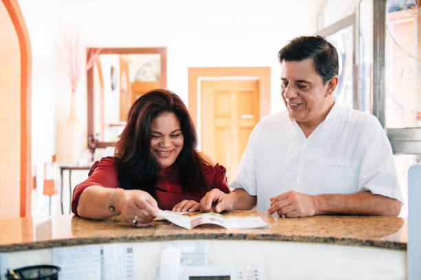 istock Senior Couple checking in at Mexican Hotel 1076723054