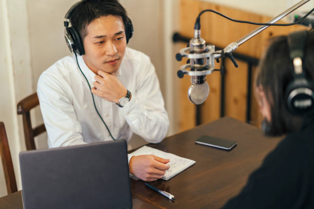 istock Two people making talkshow for radio 1076723990