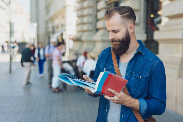 istock Attractive bearded tourist standing in a street 1076724376