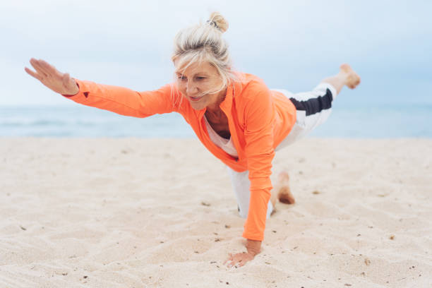 istock Mature blond woman working out doing yoga 1076727486