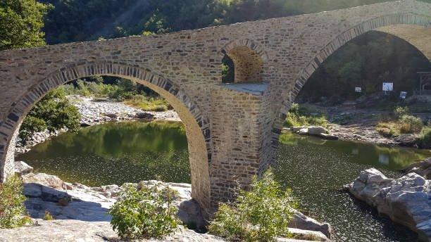 istock Landscape of medieval Devil's Bridge, Arda river and Rhodopes mountain, Bulgaria 1076728400