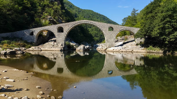istock Landscape of medieval Devil's Bridge, Arda river and Rhodopes mountain, Bulgaria 1076728738