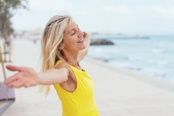 istock Happy vivacious woman on summer vacation 1076728840