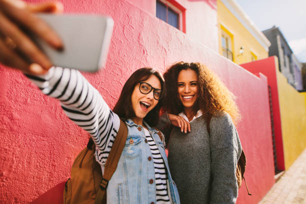istock Excited female travelers taking selfie 1076732056