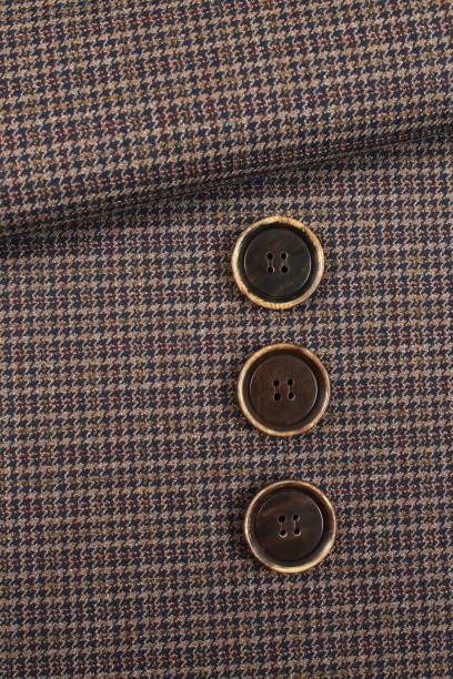 istock Buttons on a checks fabric base 1076732390