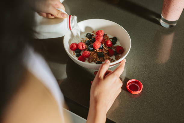 istock Woman making a healthy breakfast 1076734584
