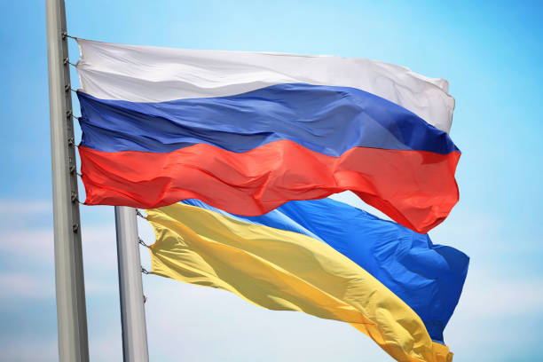 Flag of Russia and Ukraine Flag of Russia and Ukraine against the background of the blue sky russia stock pictures, royalty-free photos & images