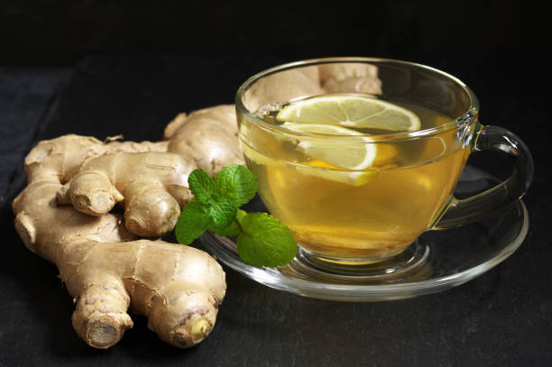 istock Ginger tea with lemon in glass cup 1076739042