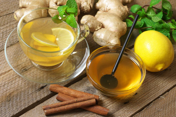 istock Ginger tea with ingredients on wood 1076739094