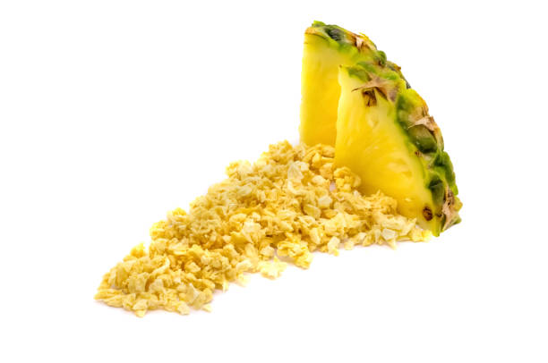 Freeze dried and fresh pineapple ananas on a white background. Freeze dried and fresh pineapple ananas on a white background. Lyophilization. Food for astronauts. Isolated ananas stock pictures, royalty-free photos & images