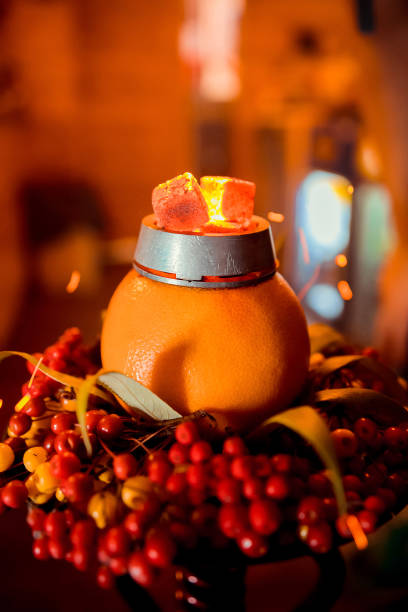 istock Hookah on orange with mint and citrus fruit 1076771258