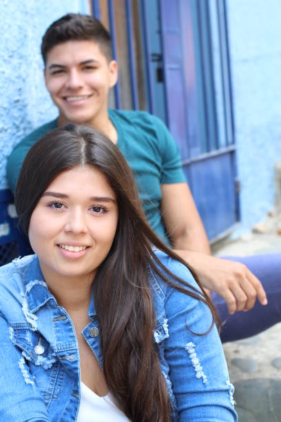 istock Cute girl with blurred boy in the background 1076771370