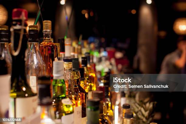 Bottles Of Spirits And Liquor At The Bar Stock Photo - Download Image Now - Happy Hour, Abstract, Alcohol - Drink
