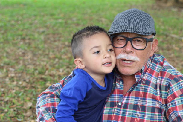 Protective grandfather with baby grandson.