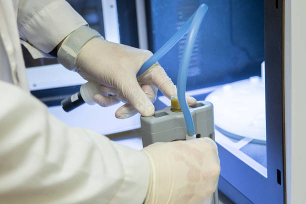 istock Serious clinician studying chemical element in working environment 1076776574