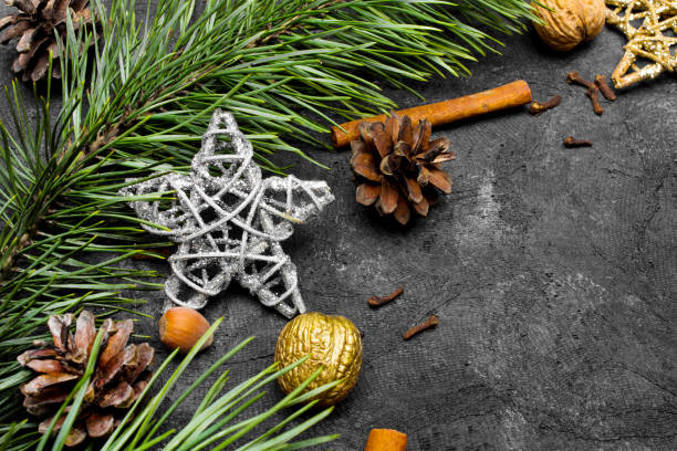 istock Beautiful Christmas Background with copy space for your text. Pine branch, cones, cinnamon and nuts 1076777370