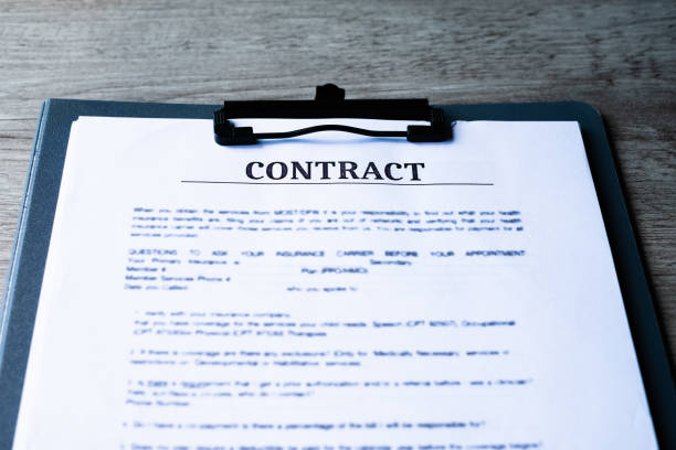 istock Contract papers on wooden desk. 1076783560
