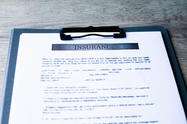 istock Insurance contract papers on wooden desk, house contract document. Agreement concept. 1076783712