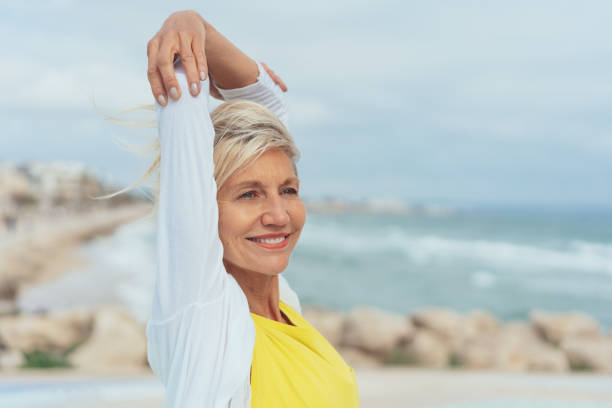 istock Happy attractive woman at the seaside 1076784178