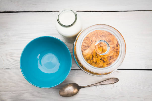 Corn Flakes with milk for Breakfast on table