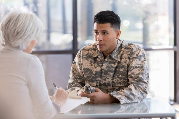 istock Soldier talks with mental health professional 1076785794